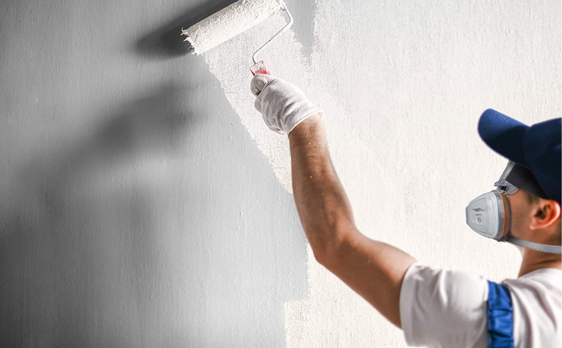 High-quality paint roller being used for wall painting, professional painting tools, wall renovation and home improvement.